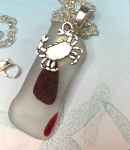 Clear and red tumbled sea glass with crab charm
